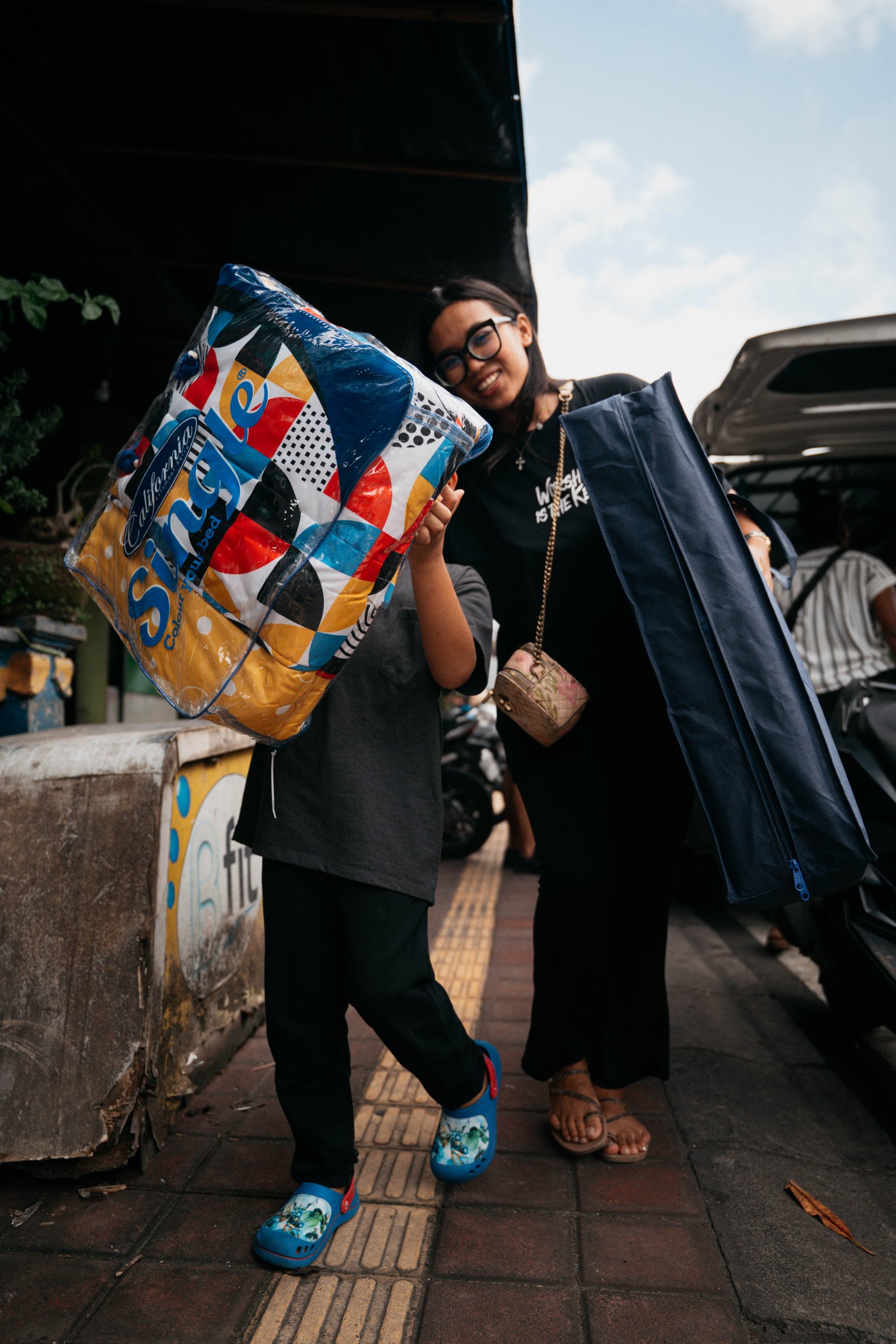 Volunteers carrying donated relief supplies